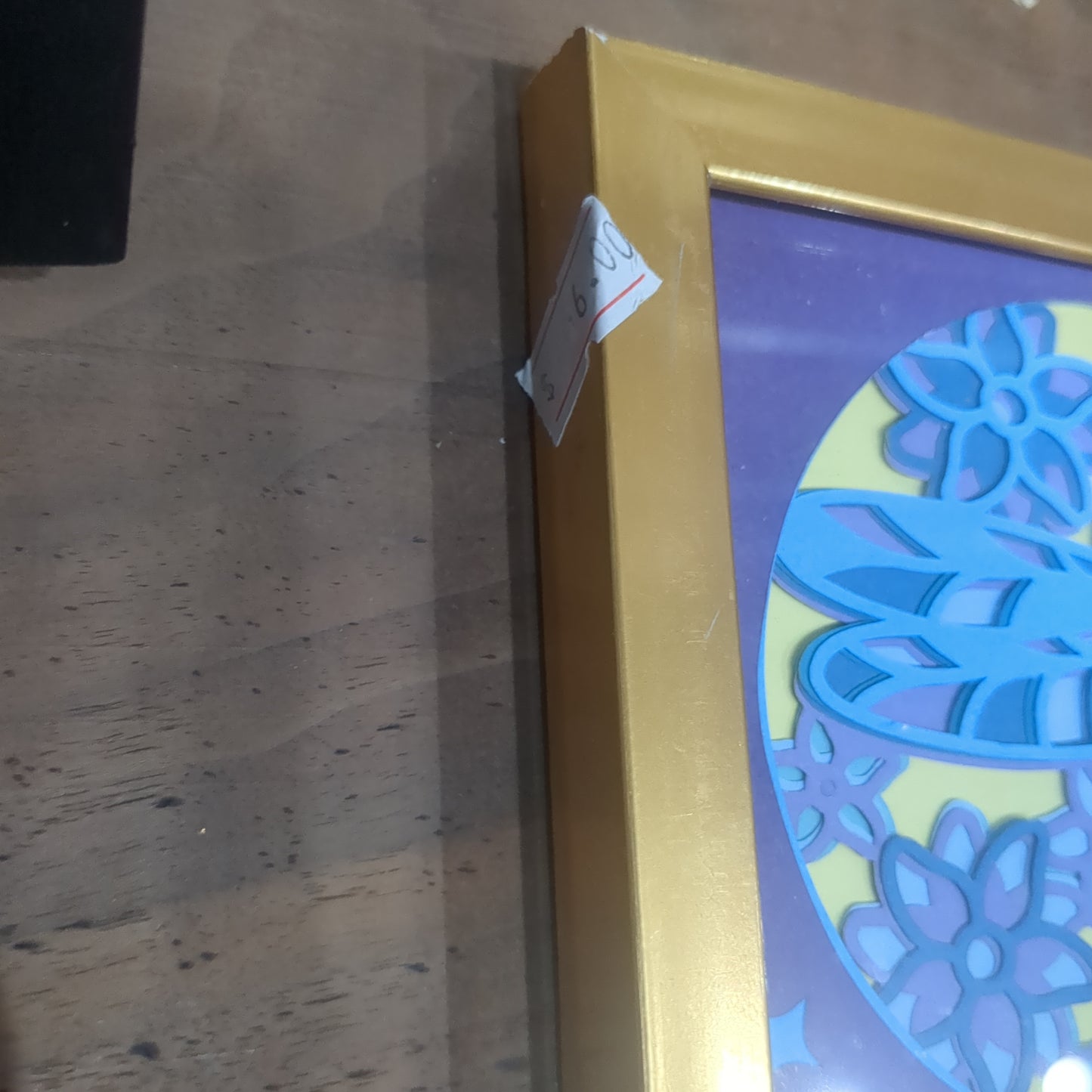 Roughly 5 by 6 inch gold shadow box with paper cut dragonfly