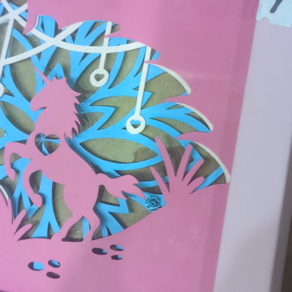 Roughly 5 x 6 inch pink shadow box frame with Papercut unicorn