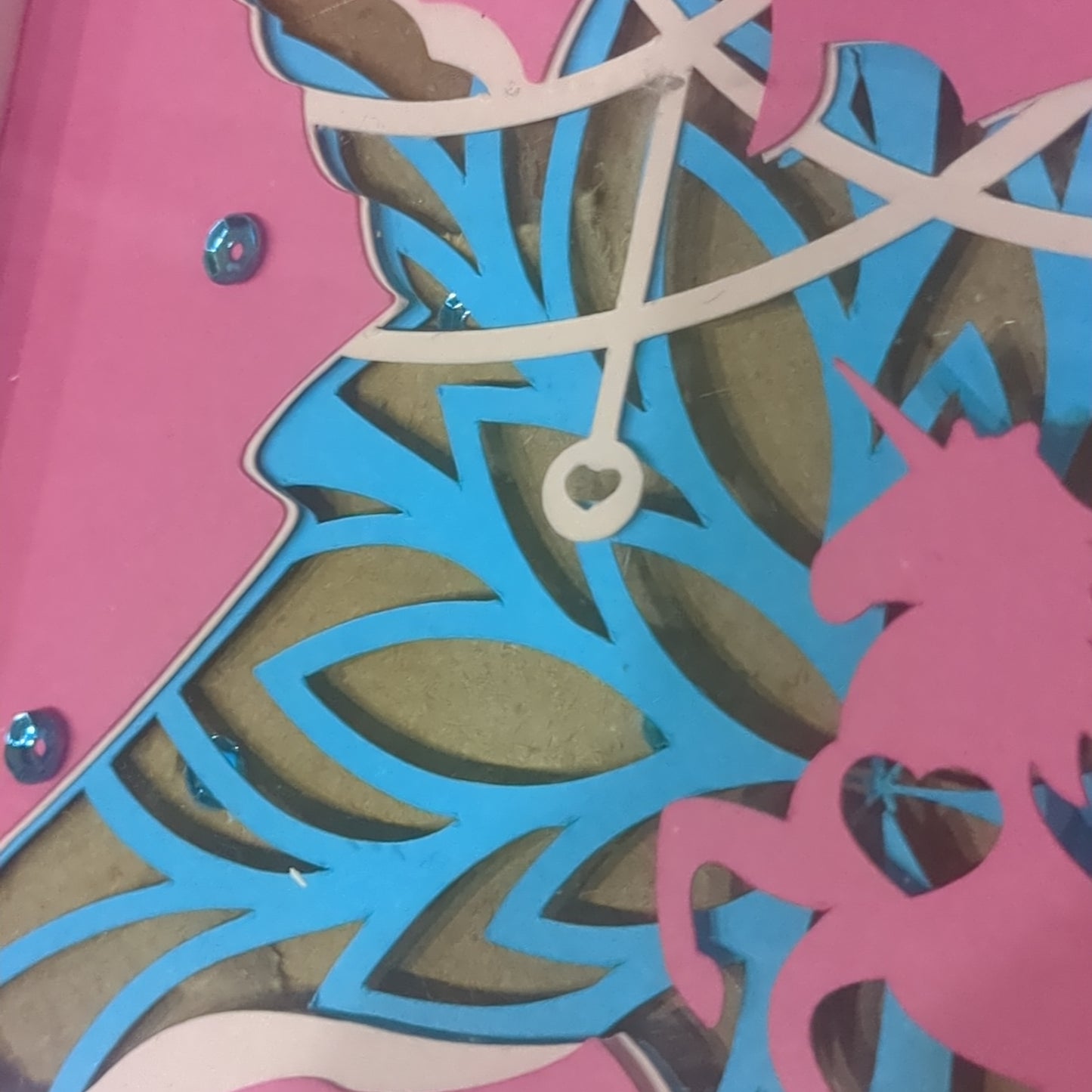 Roughly 5 x 6 inch pink shadow box frame with Papercut unicorn