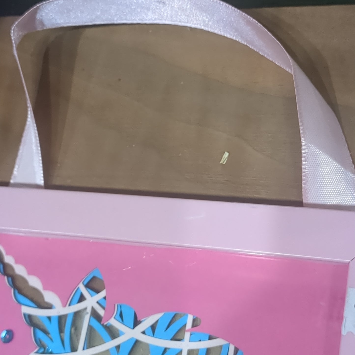 Roughly 5 x 6 inch pink shadow box frame with Papercut unicorn