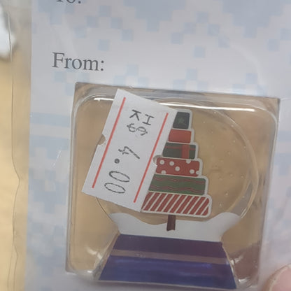 Pocket charm snow globe appearance with tree inside. friends are the true gifts of Christmas.