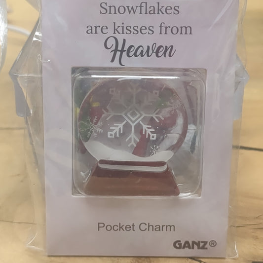 Pocket charm snow globe appearance with snowflake inside. Snowflakes are kisses from heaven
