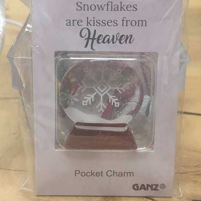 Pocket charm snow globe appearance with snowflake inside. Snowflakes are kisses from heaven