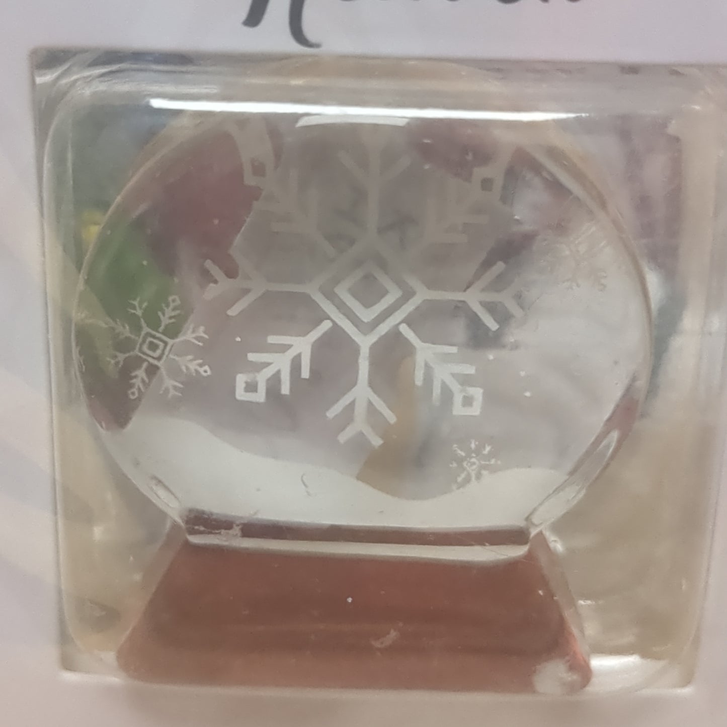 Pocket charm snow globe appearance with snowflake inside. Snowflakes are kisses from heaven