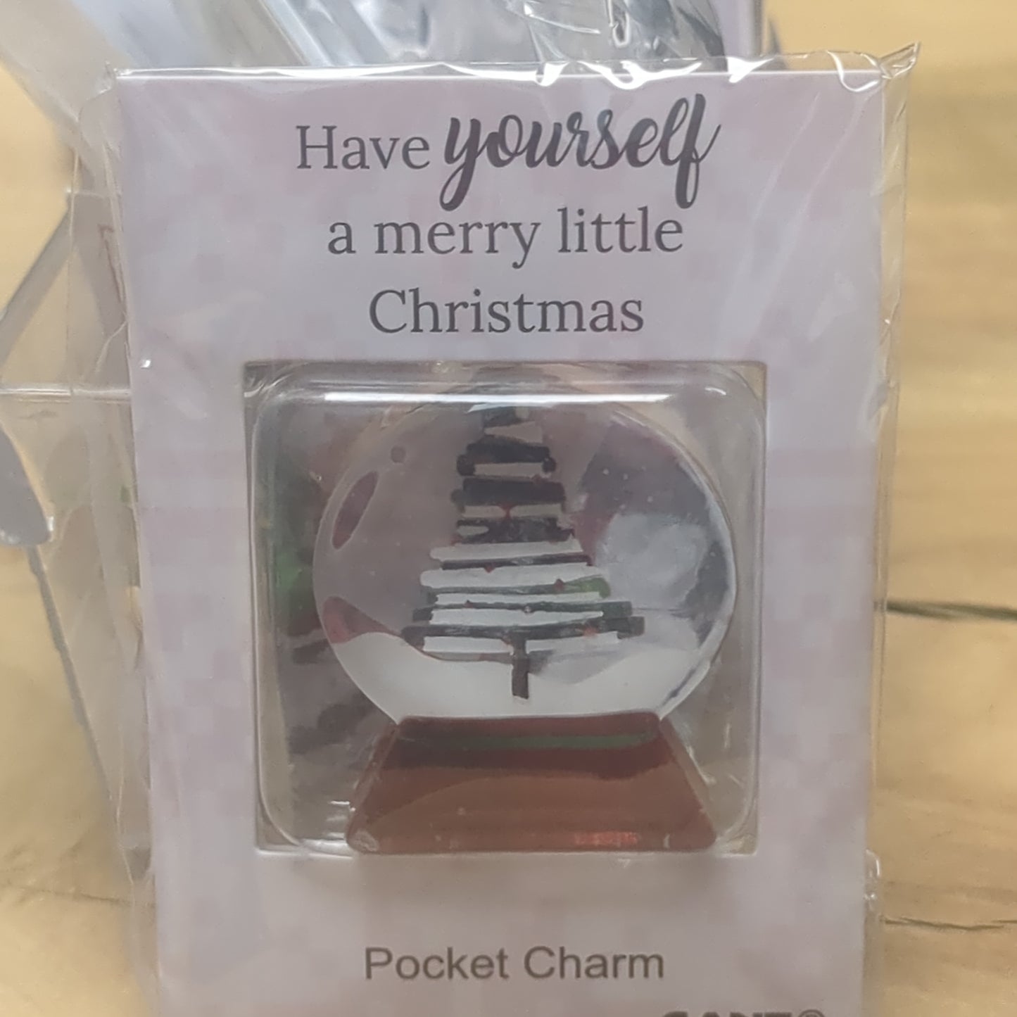 Pocket charm snow globe appearance with tree inside. Have yourself a Merry Little Christmas