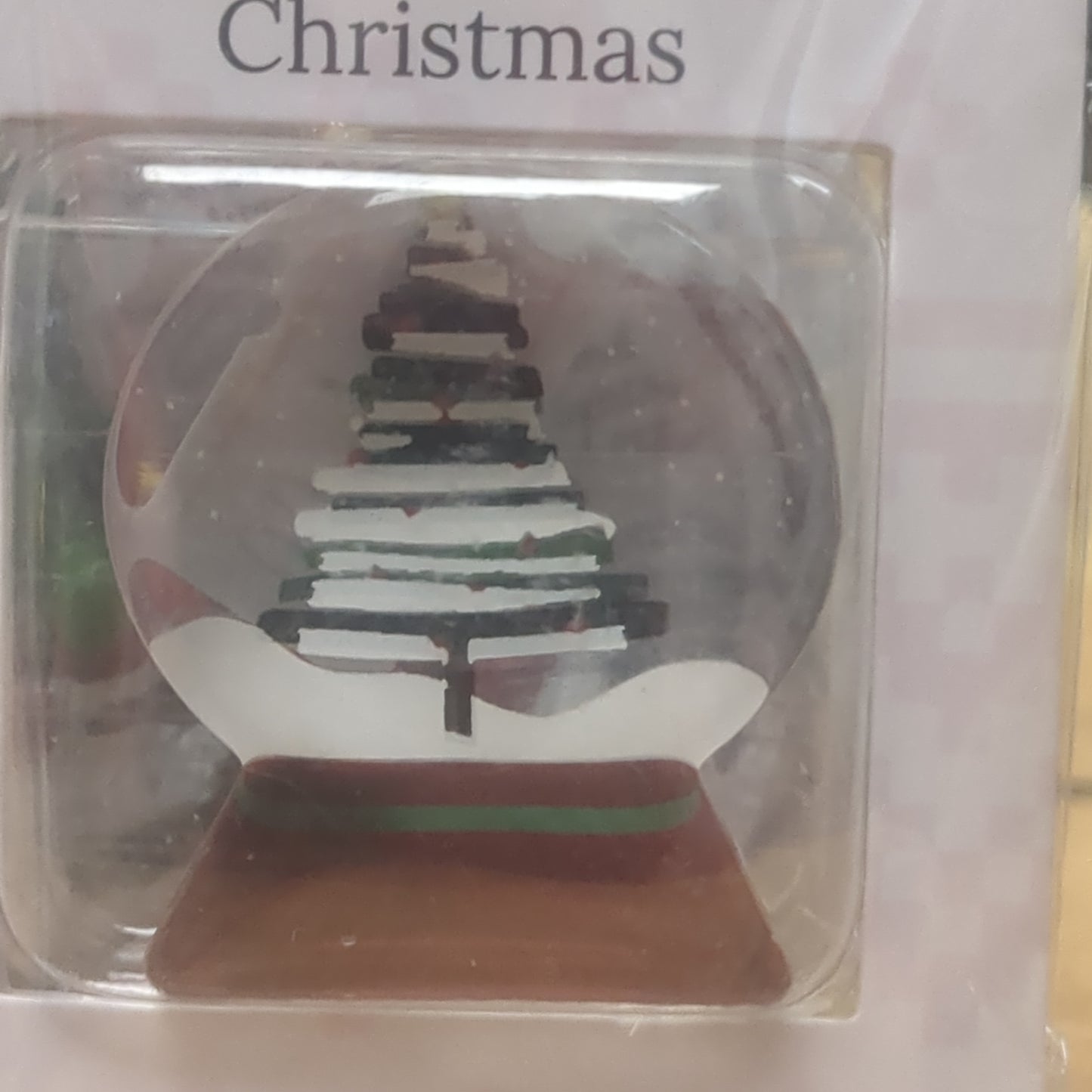 Pocket charm snow globe appearance with tree inside. Have yourself a Merry Little Christmas
