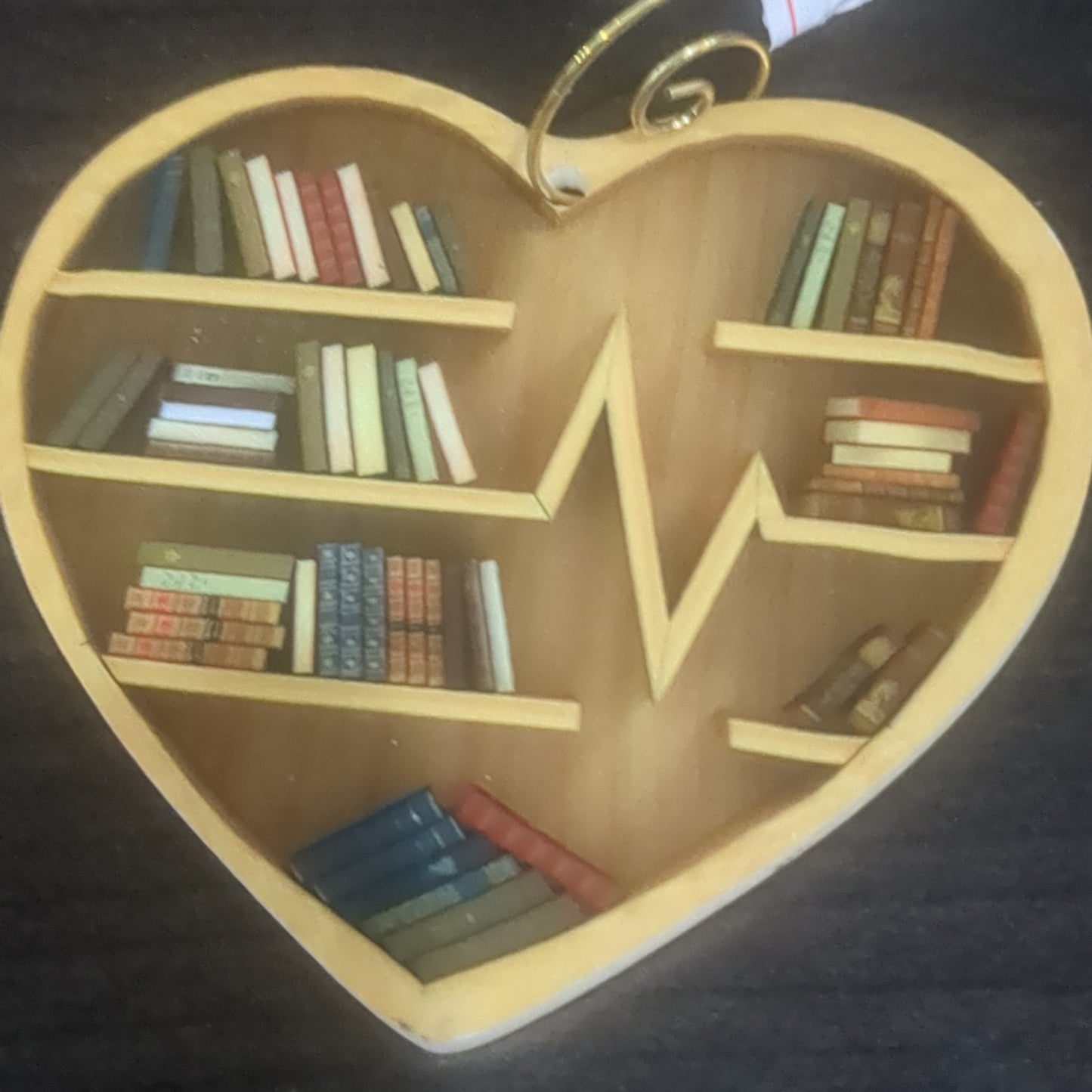 Heart-shaped ornament just a girl who loves books