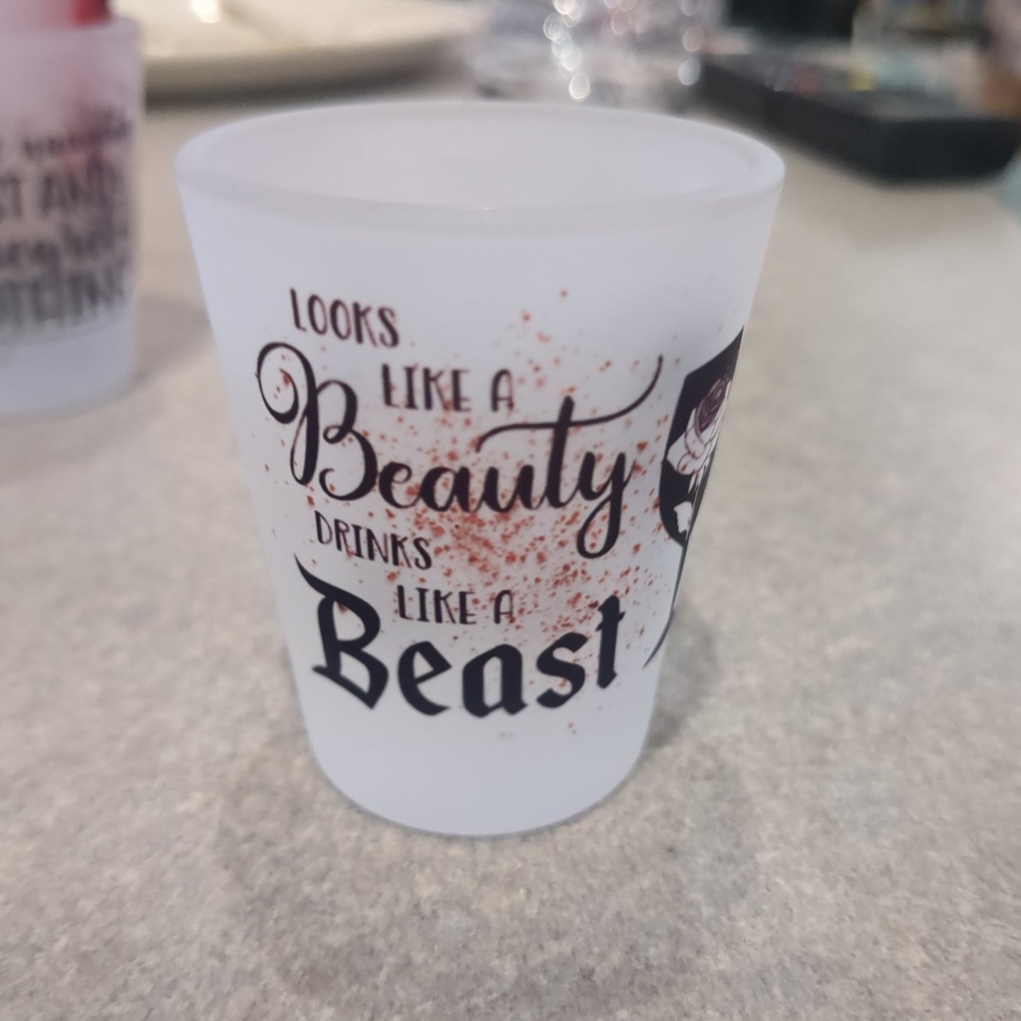 Glass shot glass.  Looks like a beauty drinks like a beast