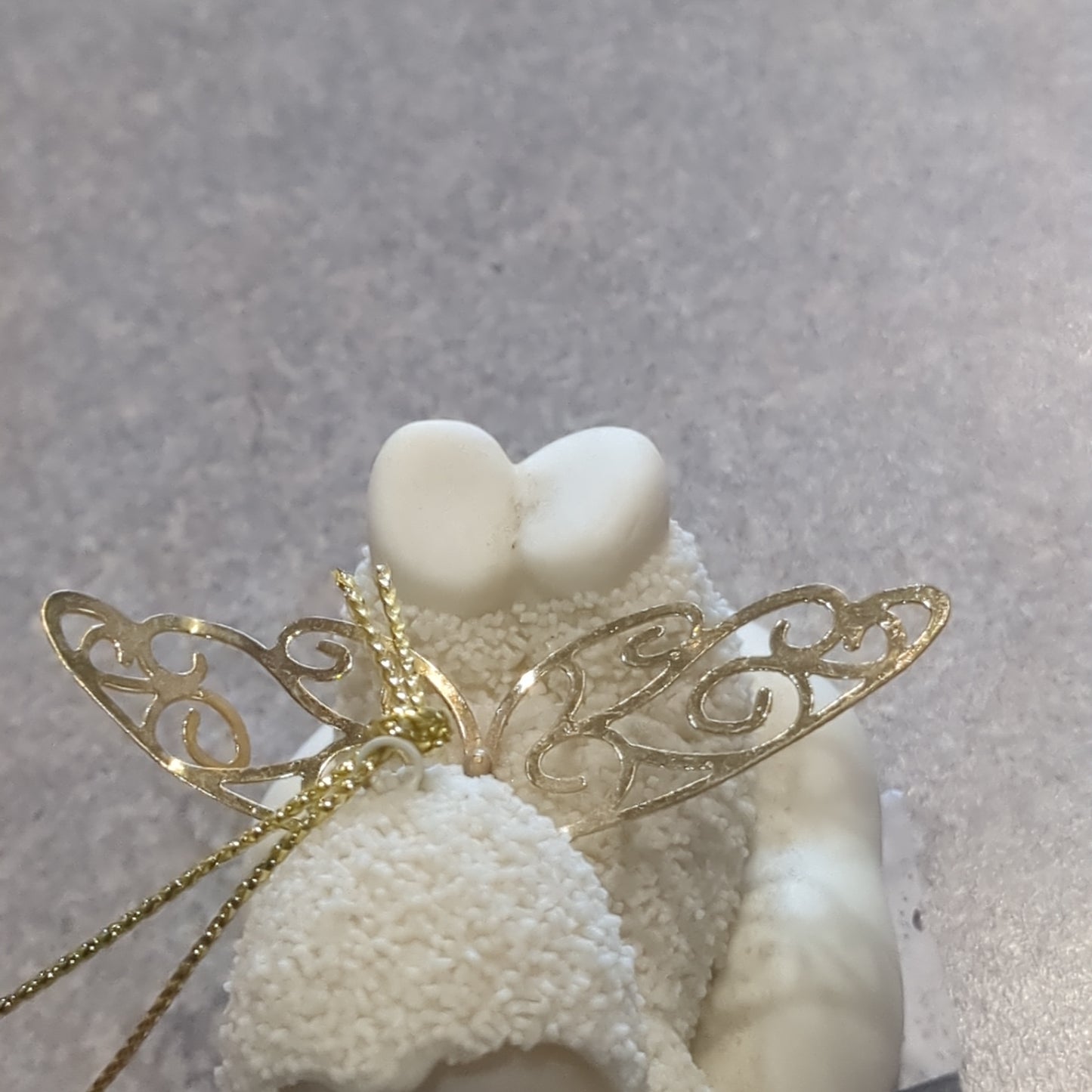 Department 56 snowbabies angel ornament laying down