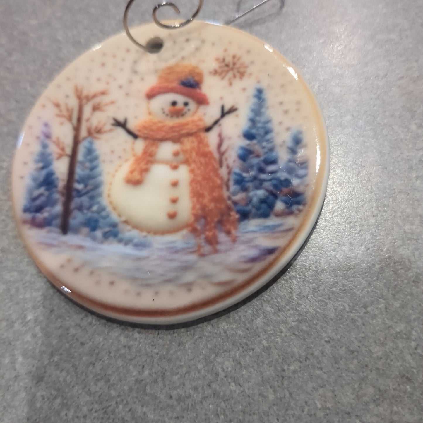 Ceramic ornament snowman with orange hat and and orange scarf