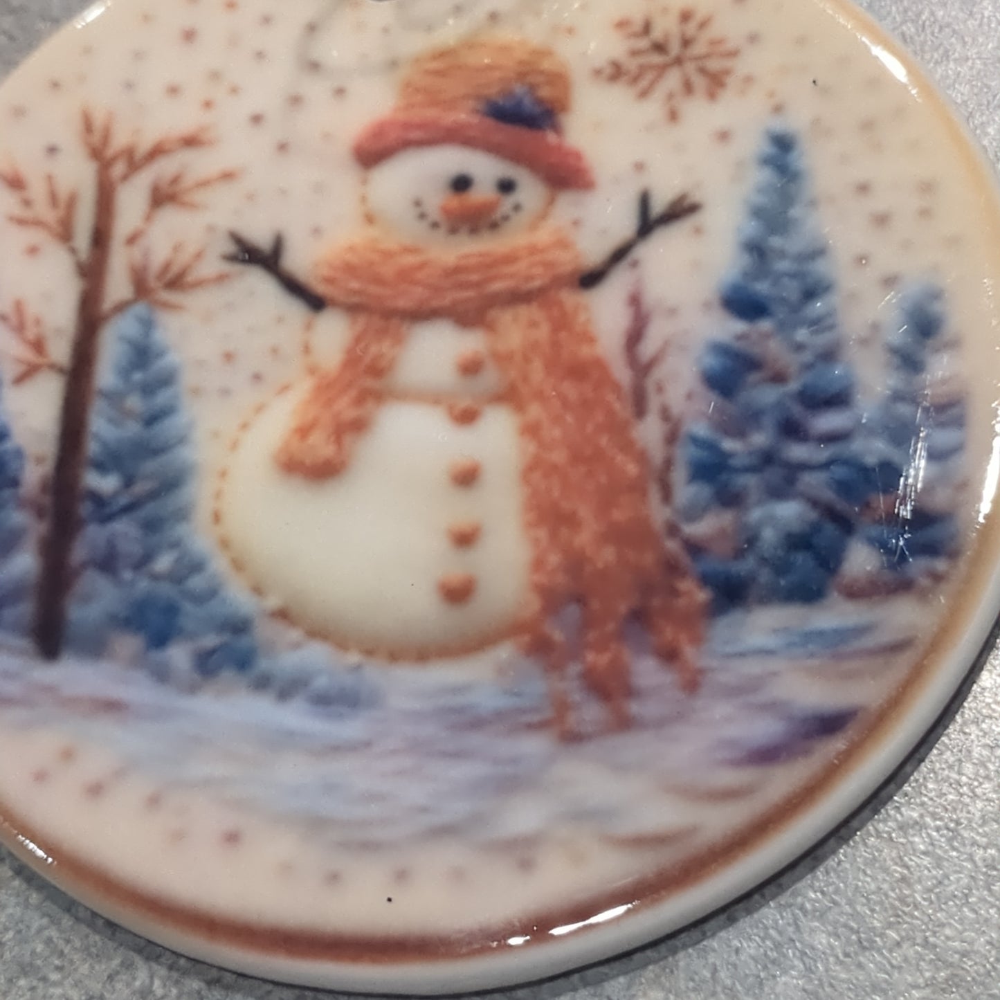 Ceramic ornament snowman with orange hat and and orange scarf
