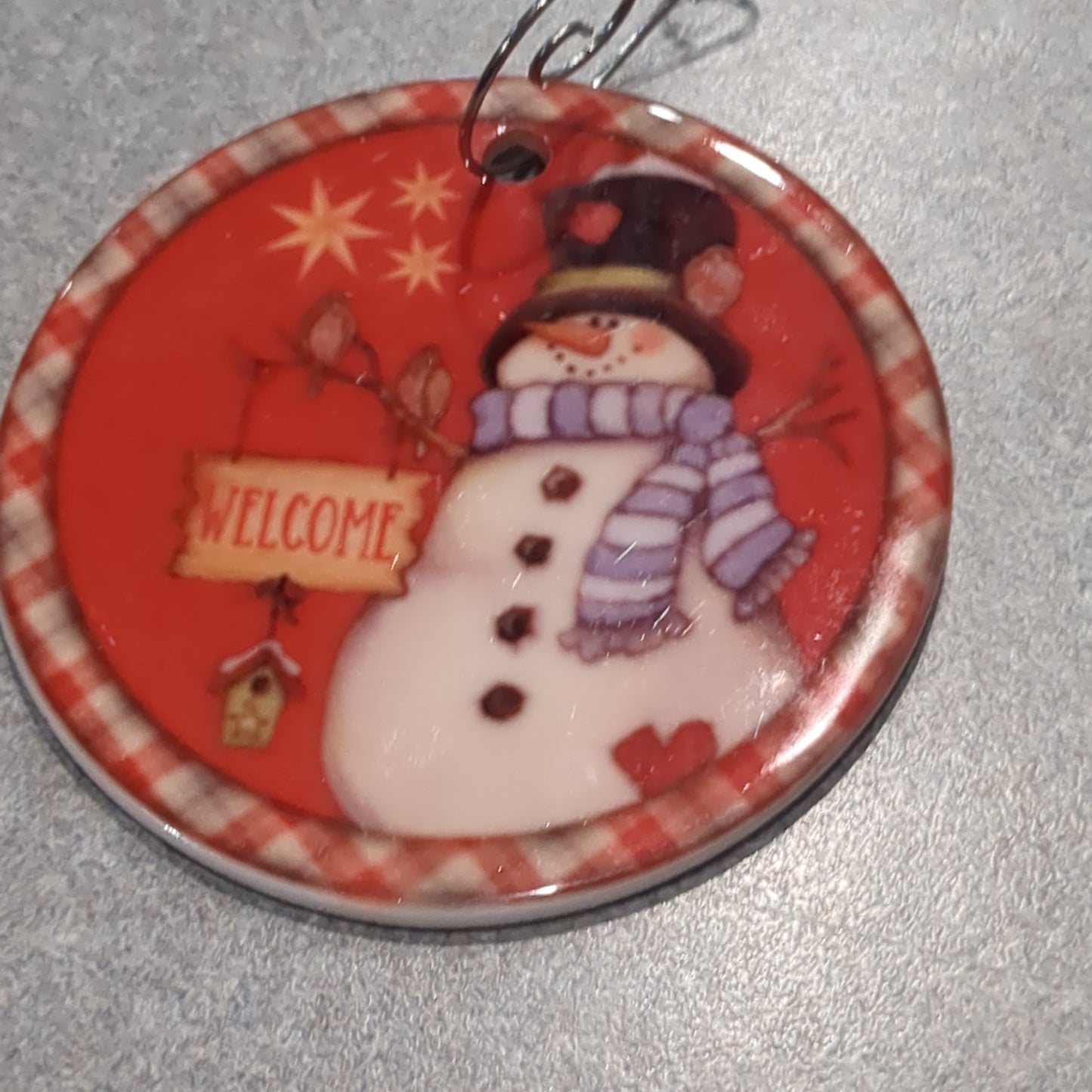 Ceramic ornament snowman with oh welcome sign with a birdhouse and two birds