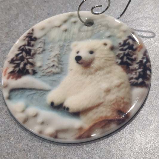 Ceramic ornament with a polar bear the lake and mountains and trees in the background, it appears 3D but it is not