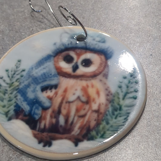Ceramic ornament owl with a blue hat and a blue scarf, it appears 3D but it is not