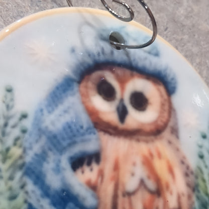 Ceramic ornament owl with a blue hat and a blue scarf, it appears 3D but it is not
