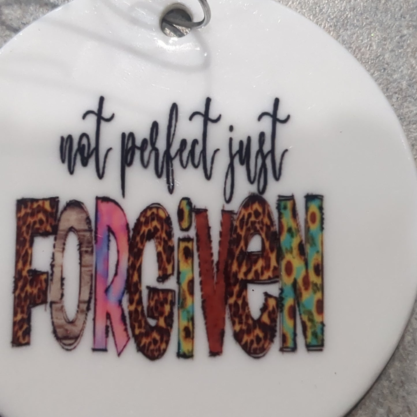Ceramic ornament with The words not perfect just forgiven