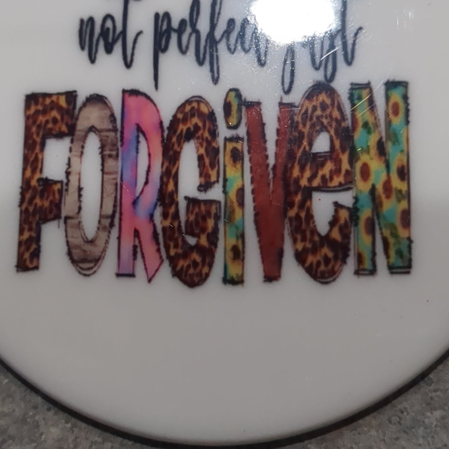 Ceramic ornament with The words not perfect just forgiven