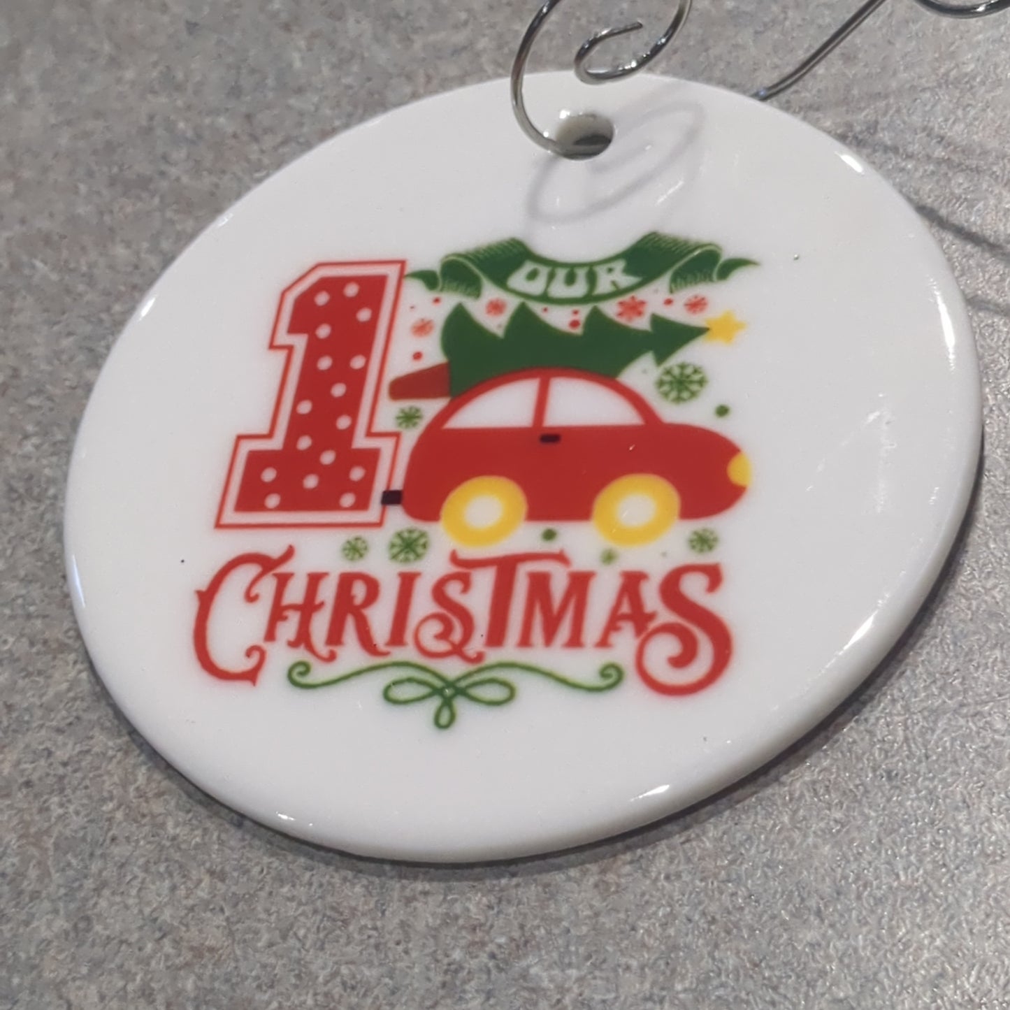 Ceramic ornament our first Christmas with a car with a tree tied on top
