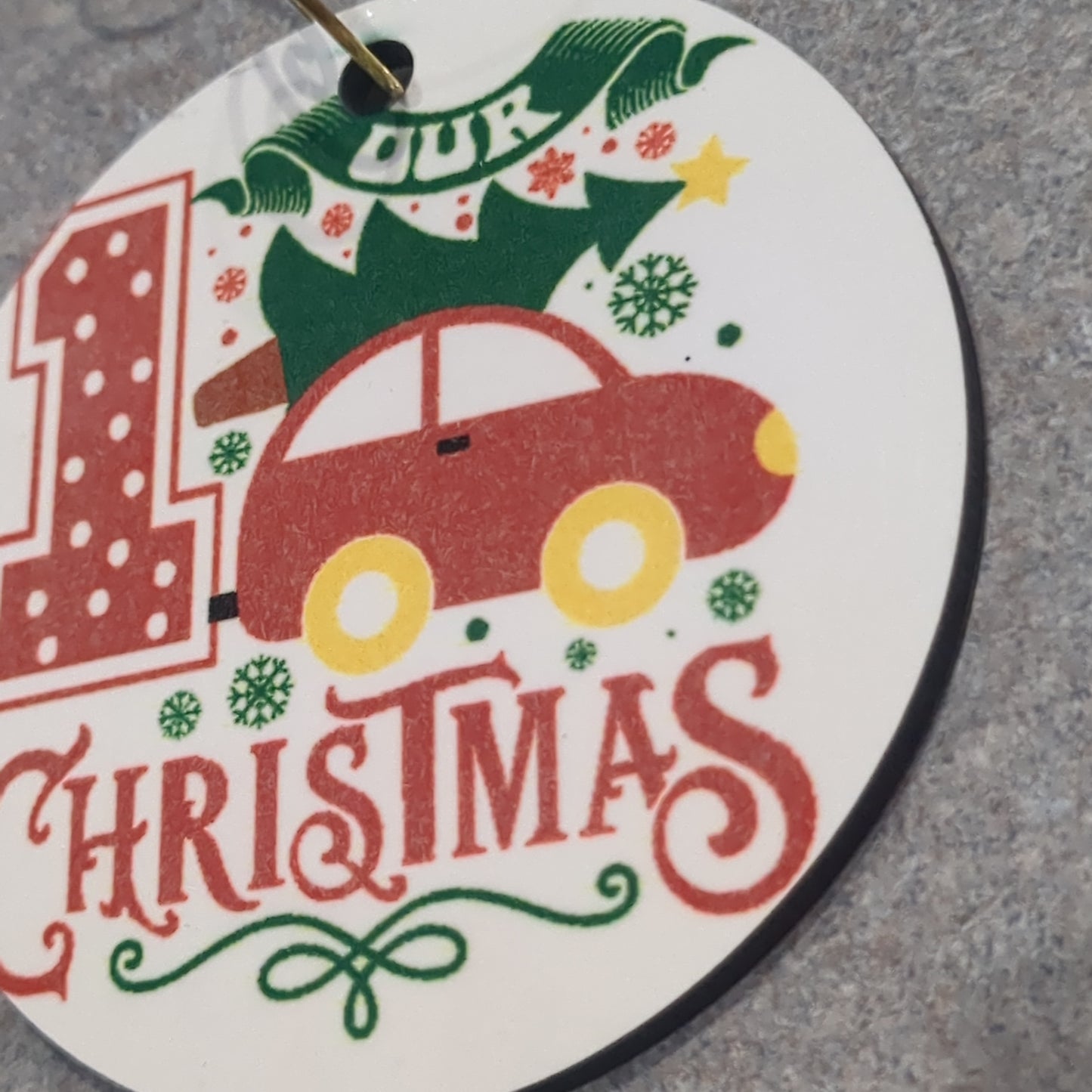 MDF ornament our first Christmas with a tree tied to the top of the car