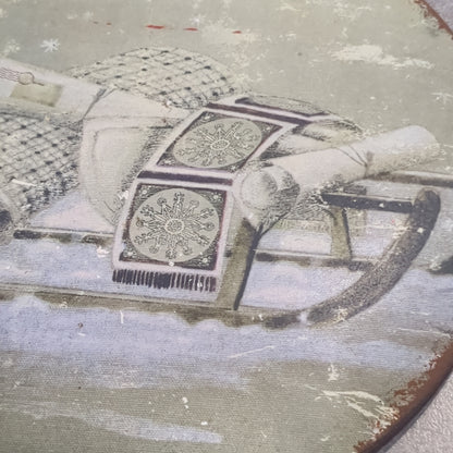 6 inch tin ornament with a sled