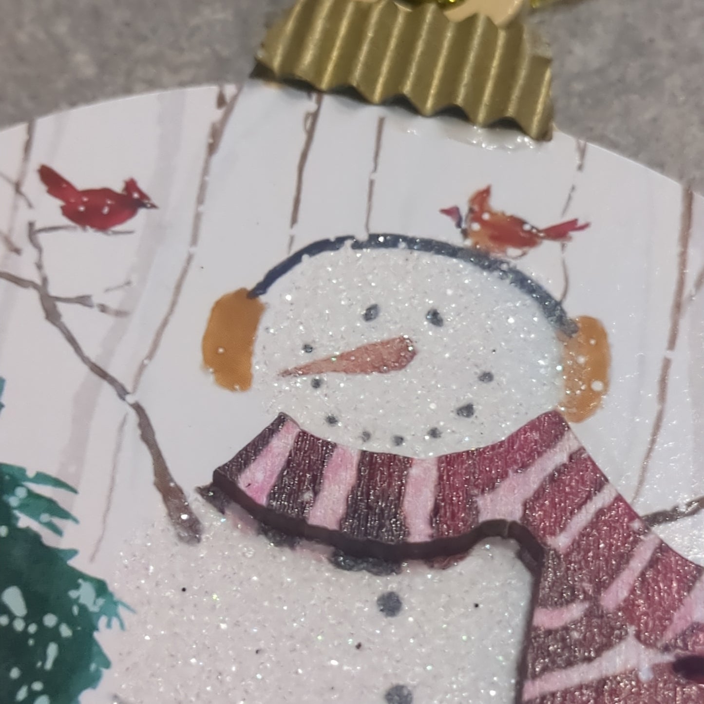 MDF ball ornament with a snowman