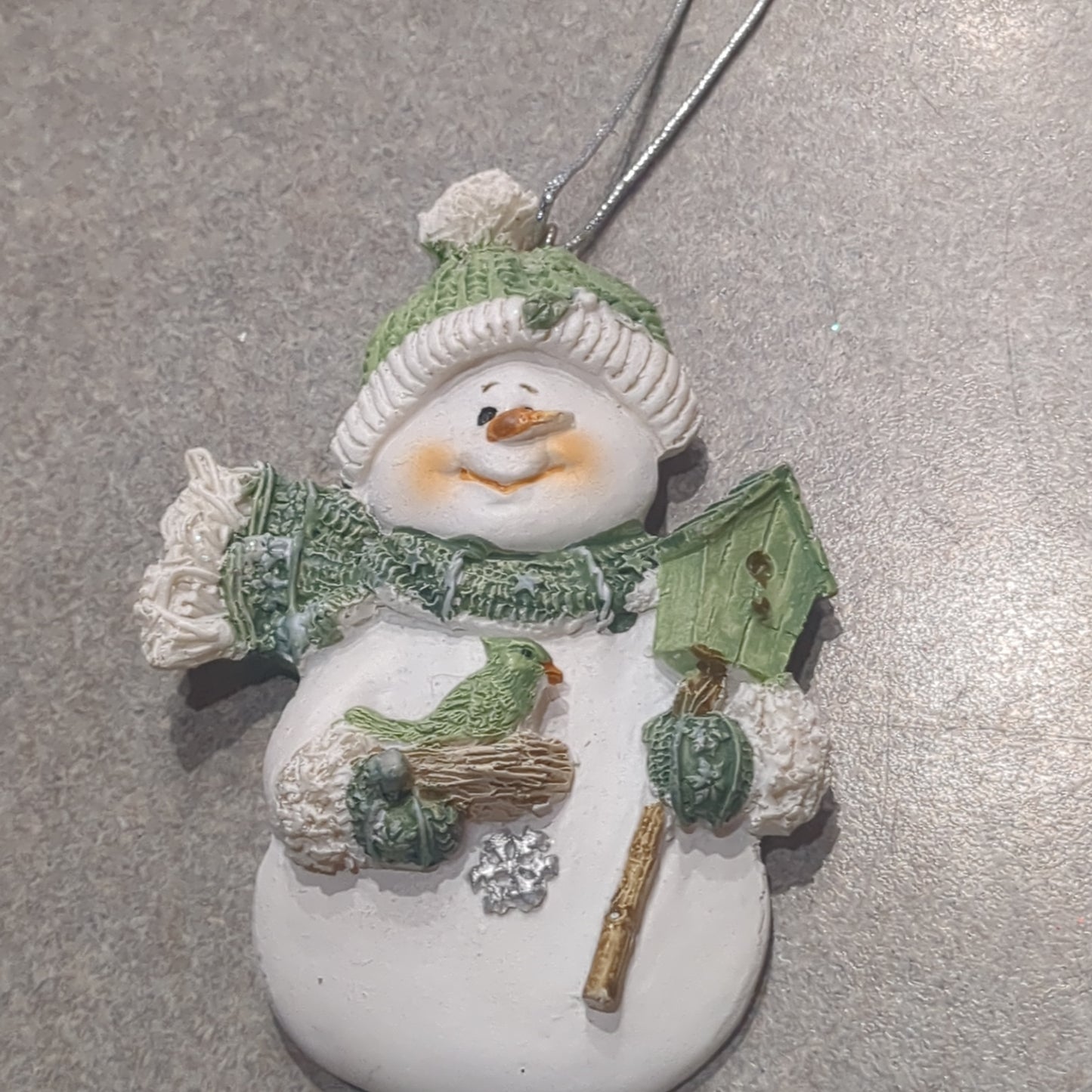 Polycrylic snowman ornament with bird and birdhouse green