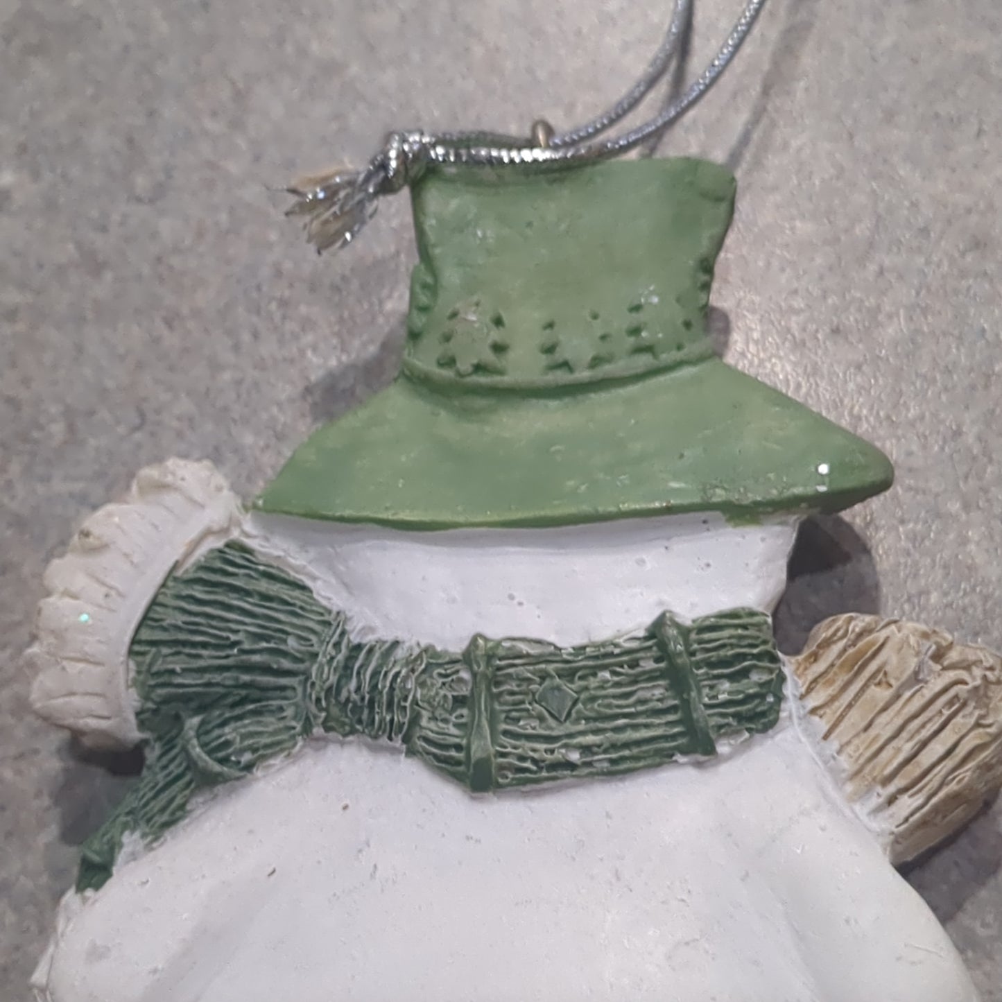 Polycrylic snowman ornament with a broom - green