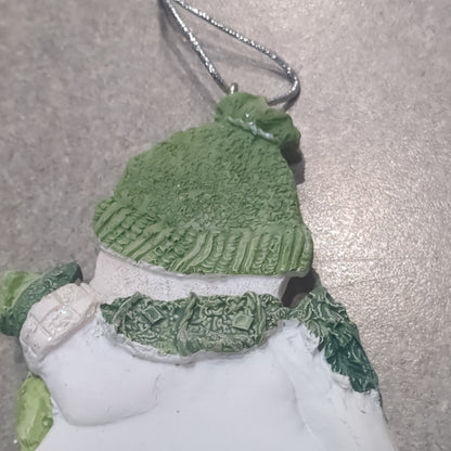 Og1 Polycrylic snowman ornament with a scroll and gift - green