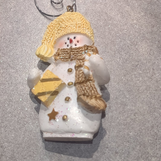 Polycrylic snowman ornament with candy cane and gift yellow