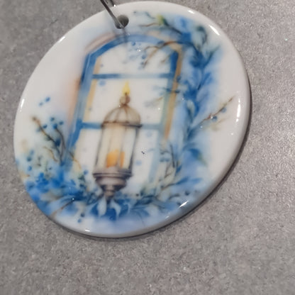 Ceramic ornament blue and white lantern in a window