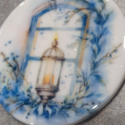 Ceramic ornament blue and white lantern in a window