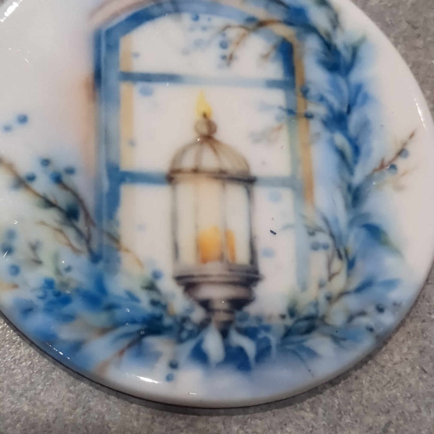 Ceramic ornament blue and white lantern in a window