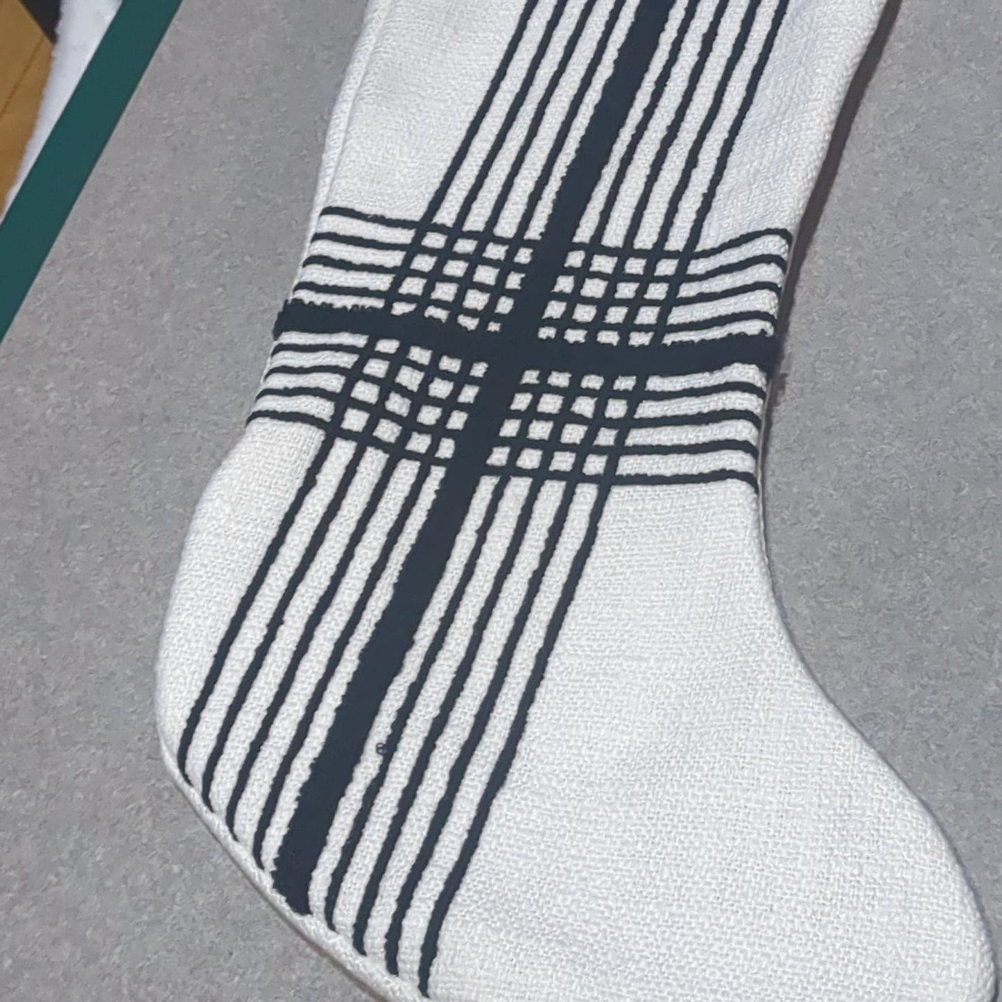 Stocking white with black stripes.