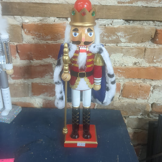 Nutcracker with blue robe and a crown.