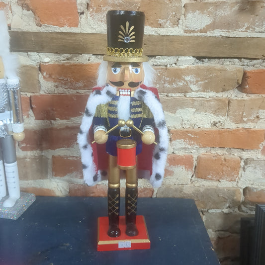 Nutcracker with red robe and a drum