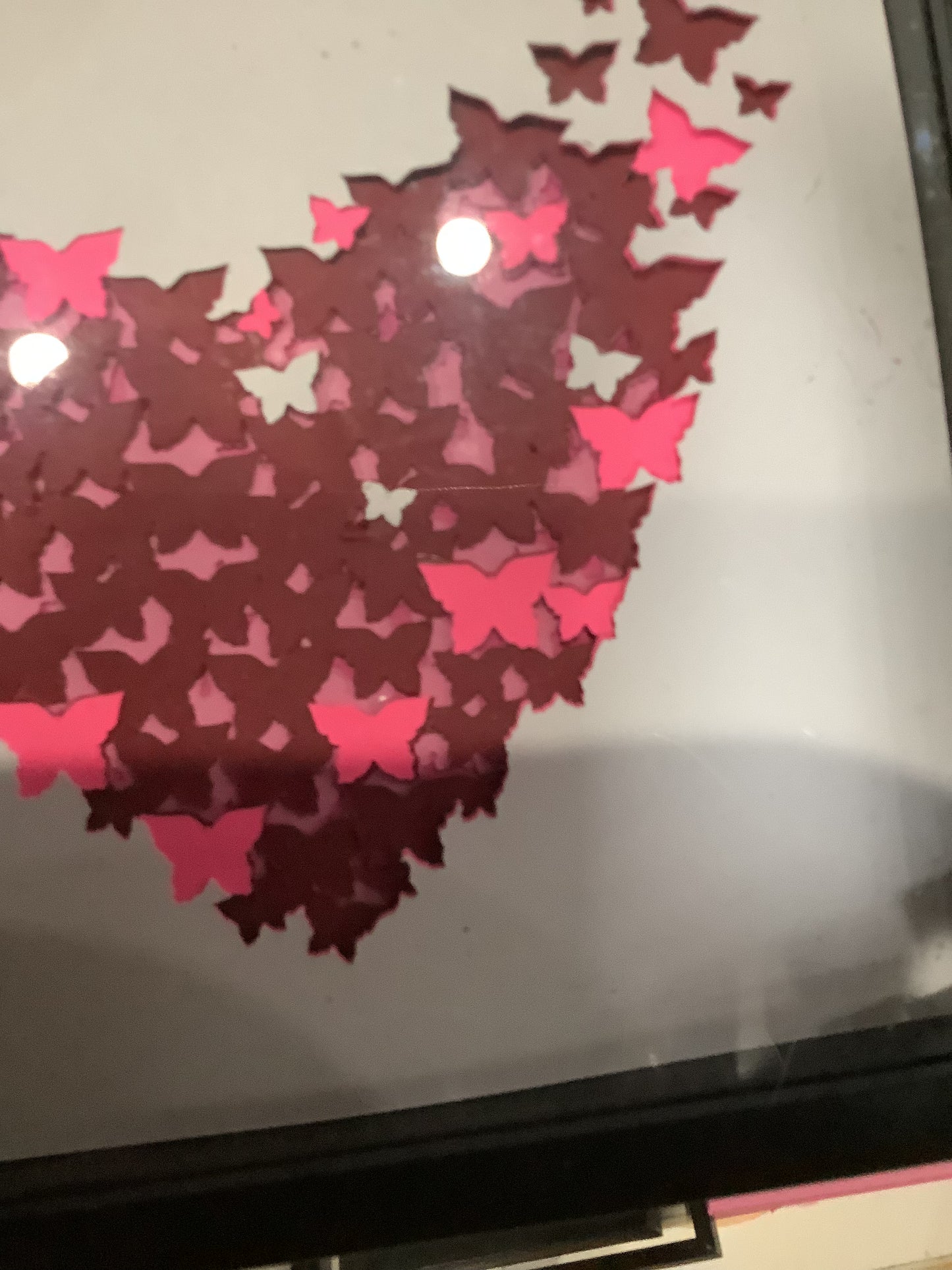 5 1/2 x 5 1/2 black shadow box with paper cut butterflies, turning into a heart
