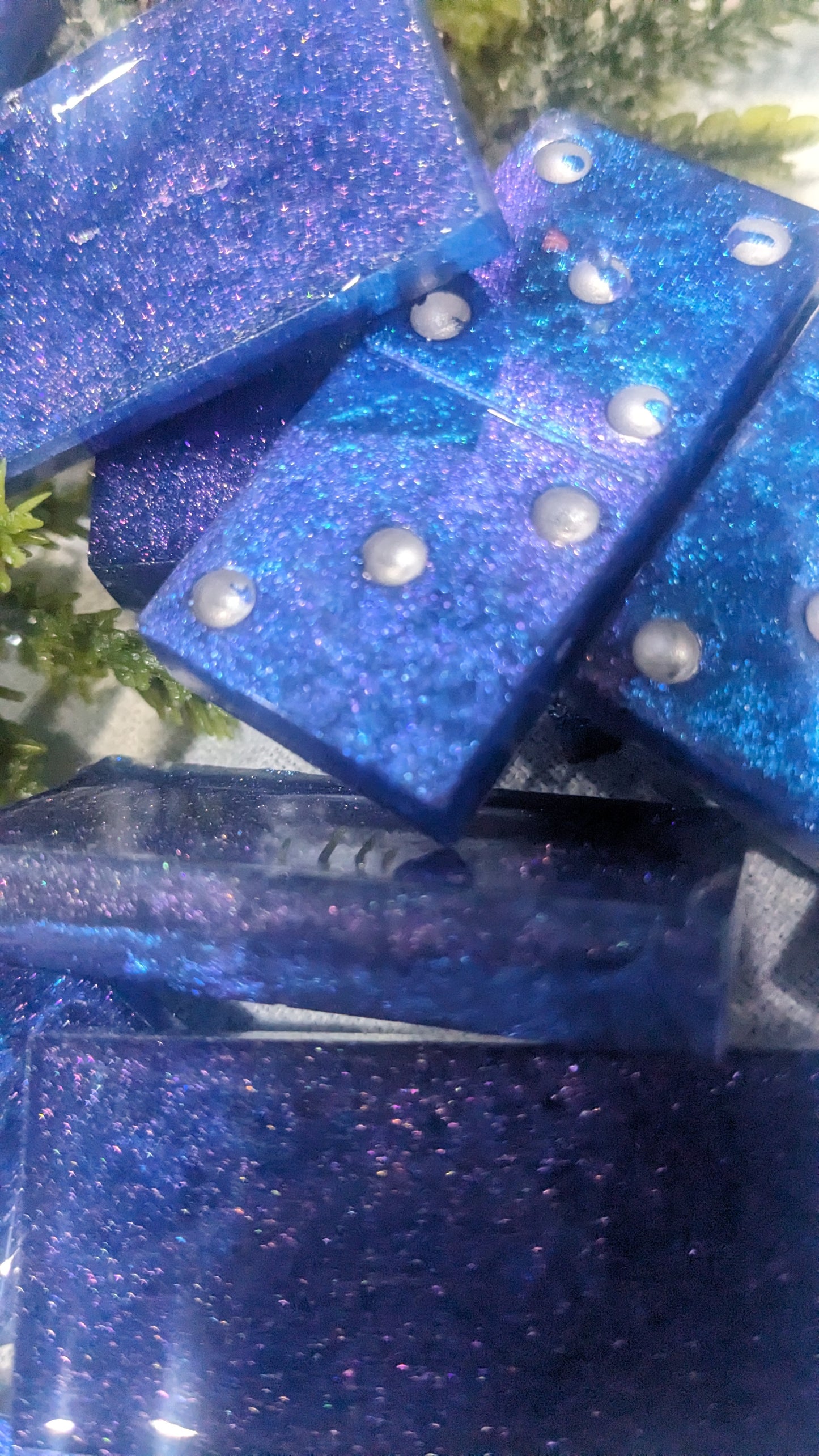 This is a set of handcrafted resin dominoes color changing blue and purple