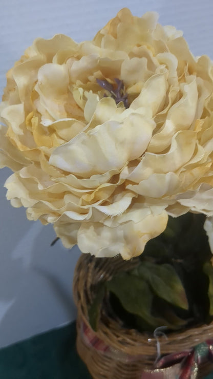 Off white floral arrangement in wicker basket