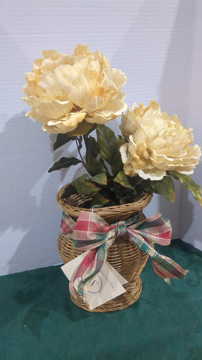 Off white floral arrangement in wicker basket
