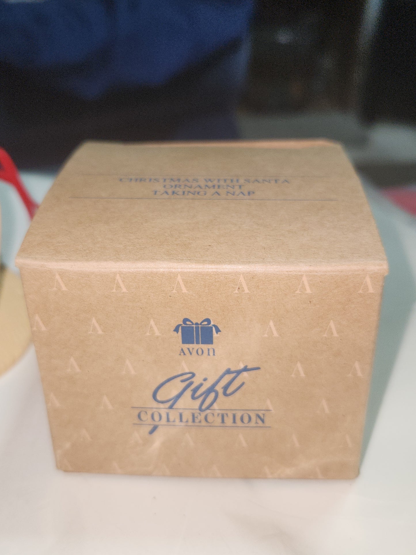 Avon Gift Collection Christmas With Santa Ornament Taking A Nap