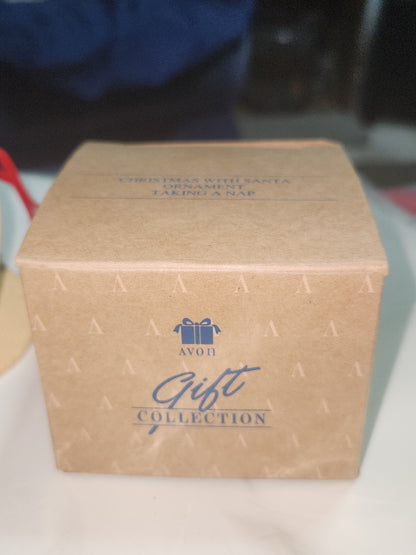 Avon Gift Collection Christmas With Santa Ornament Taking A Nap