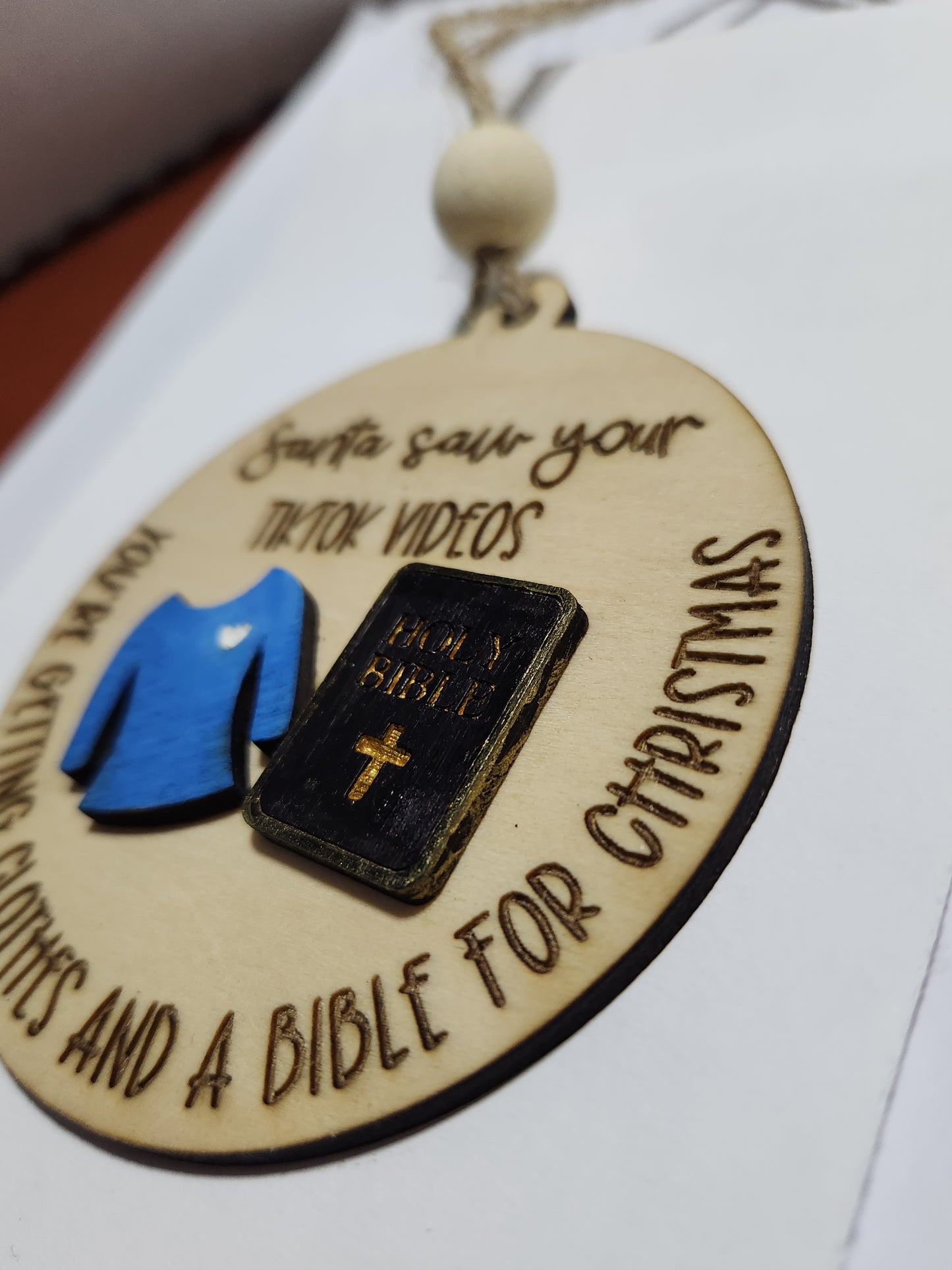 Ornament or car charm.  Santa saw your tiktok videos