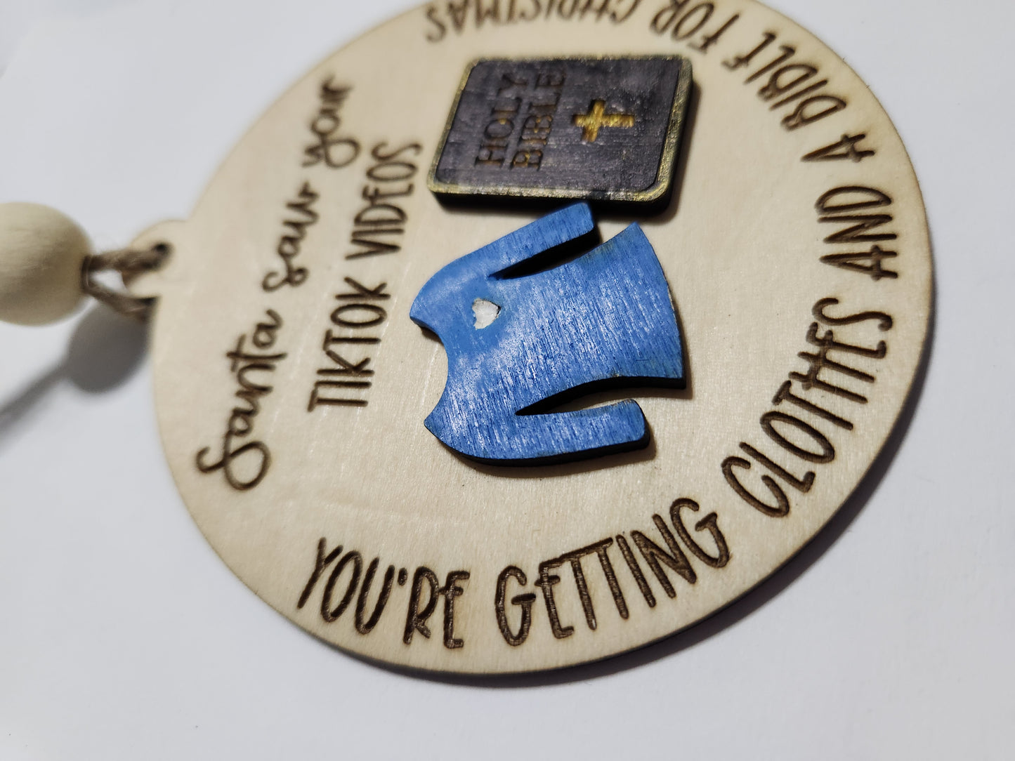 Ornament or car charm.  Santa saw your tiktok videos