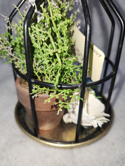 Assemblage light fixture, bottle, bird, plant, wood flower, flashcard