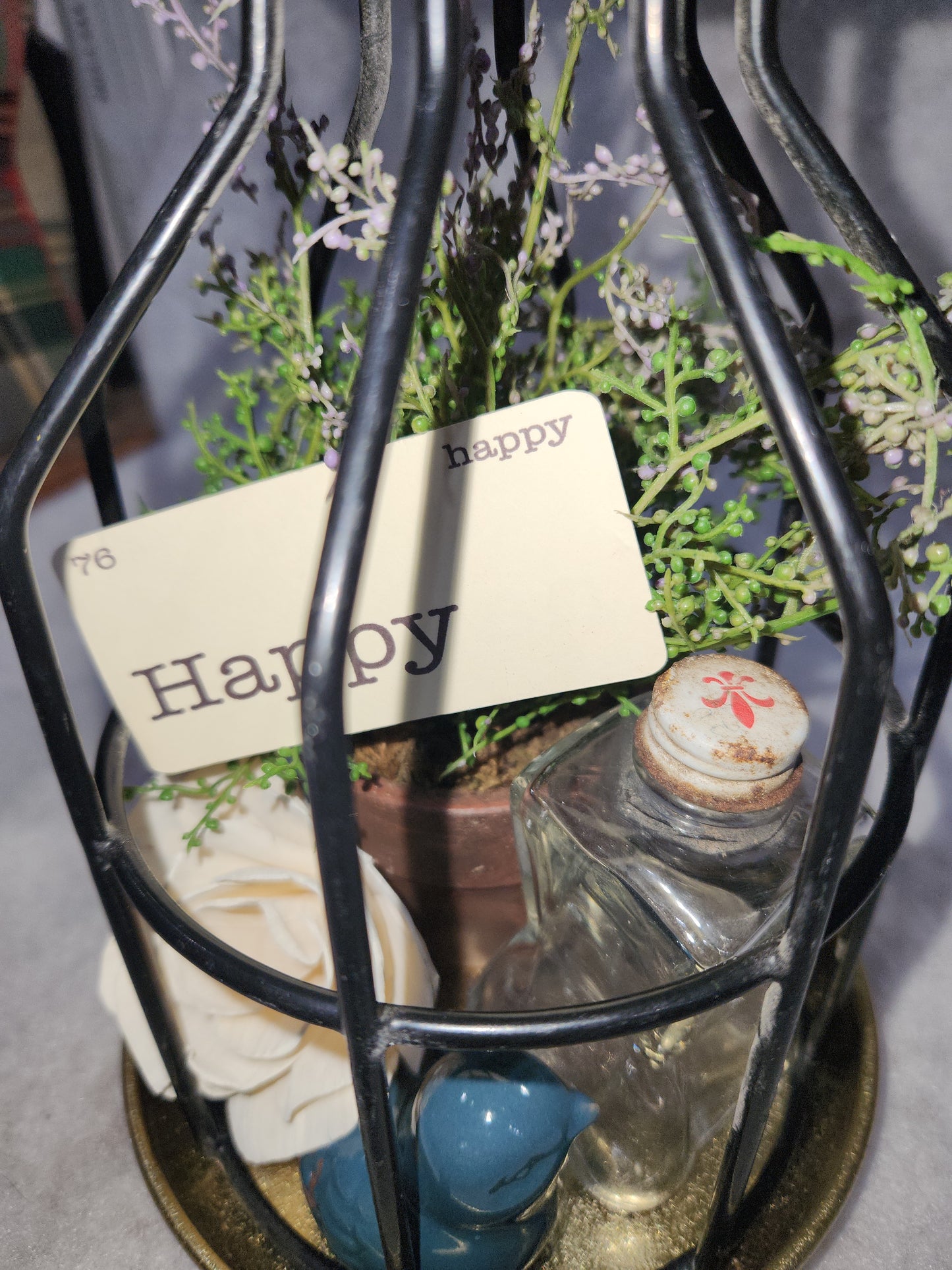 Assemblage light fixture, bottle, bird, plant, wood flower, flashcard