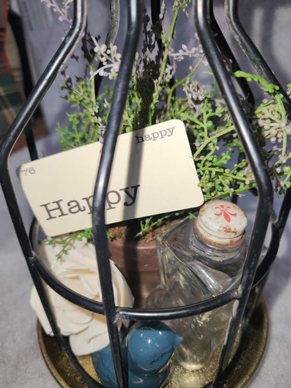 Assemblage light fixture, bottle, bird, plant, wood flower, flashcard