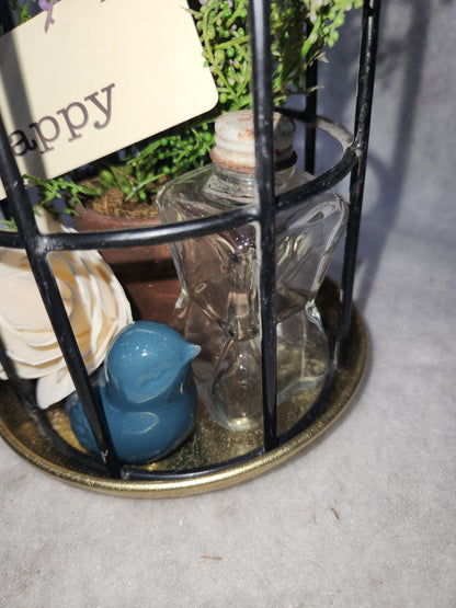 Assemblage light fixture, bottle, bird, plant, wood flower, flashcard