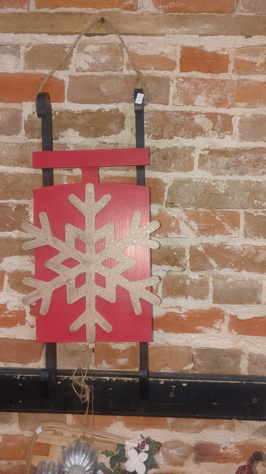 Red wooden sled with MDF snowflaked