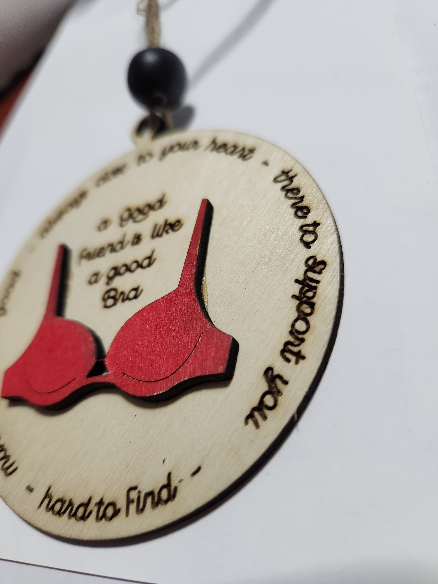 Ornament or car charm.  A good friend is like a good bra