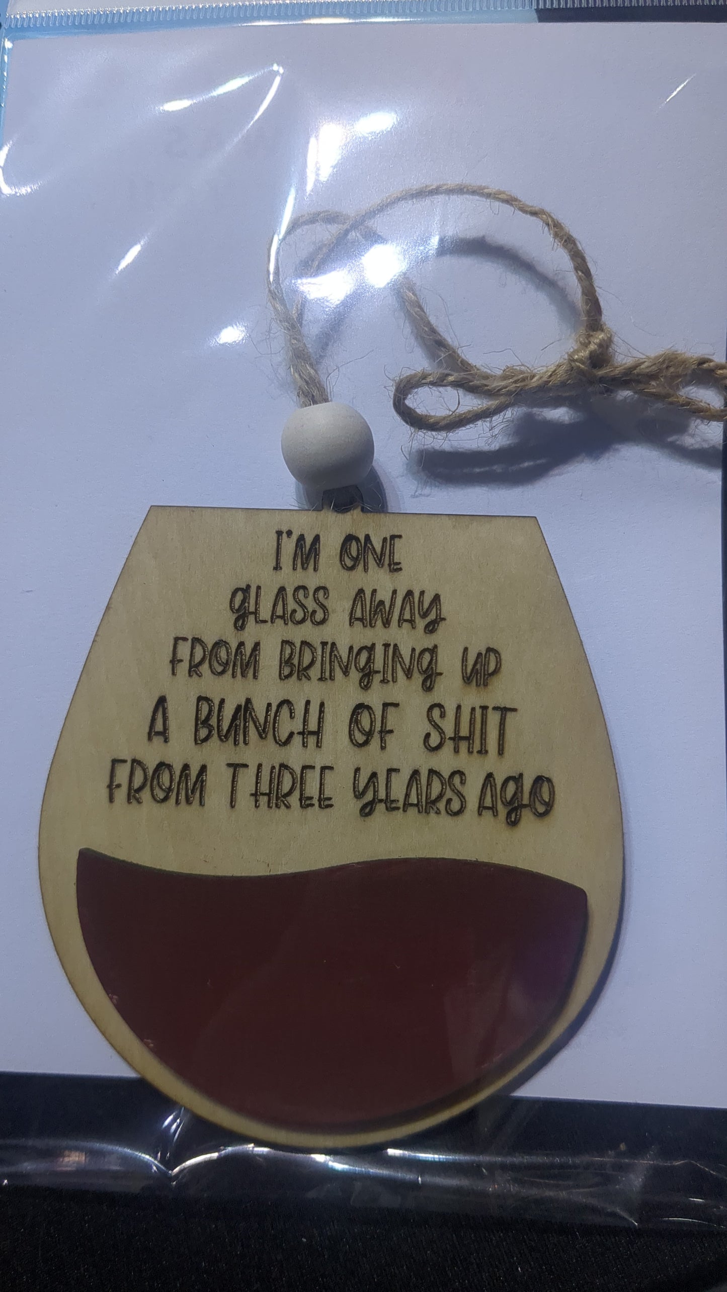 Ornament or car charm.  I'm one glass away from bringing up a bunch of s*** from 3 years ago. Red Wine glass